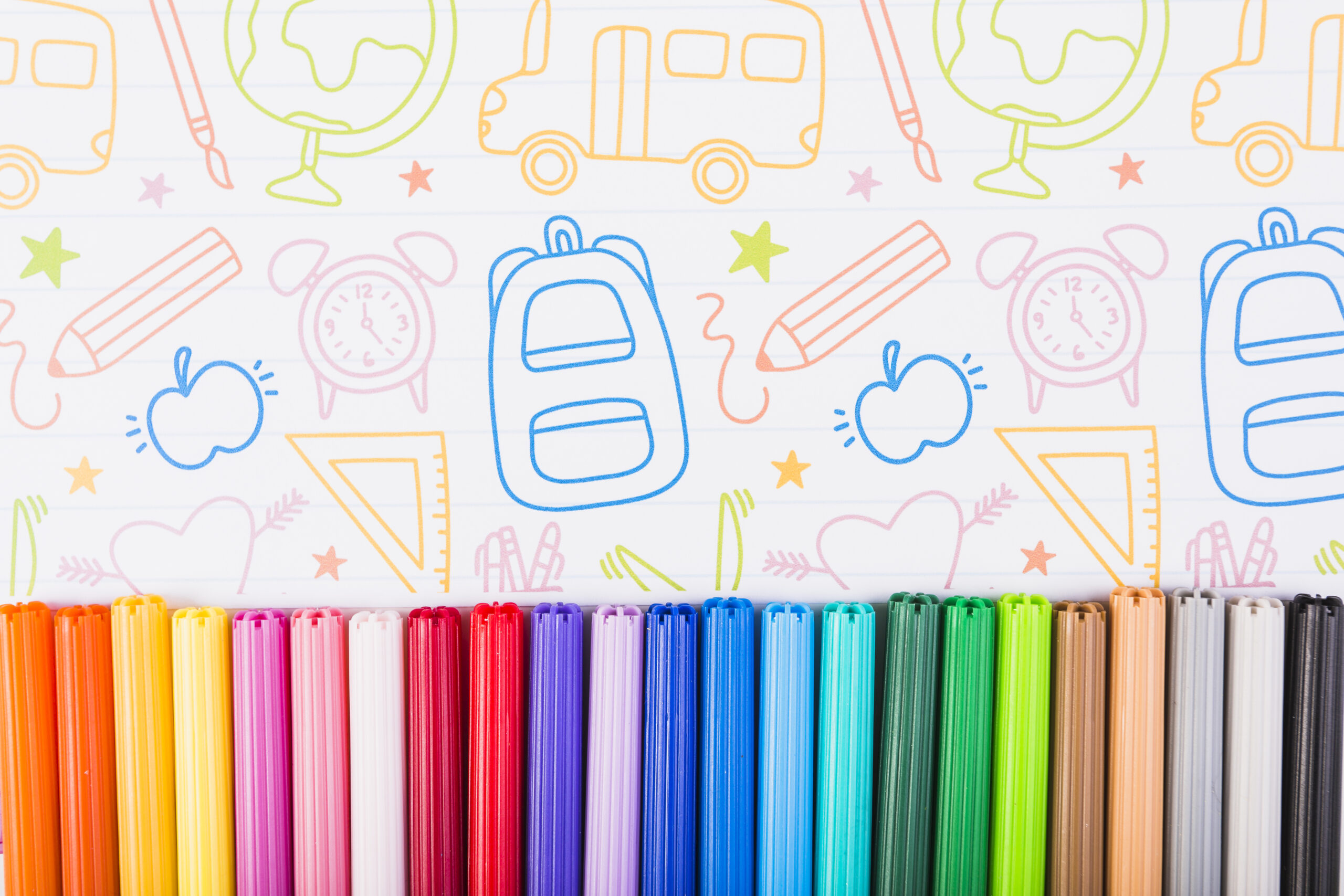 multicolored-markers-painted-paper